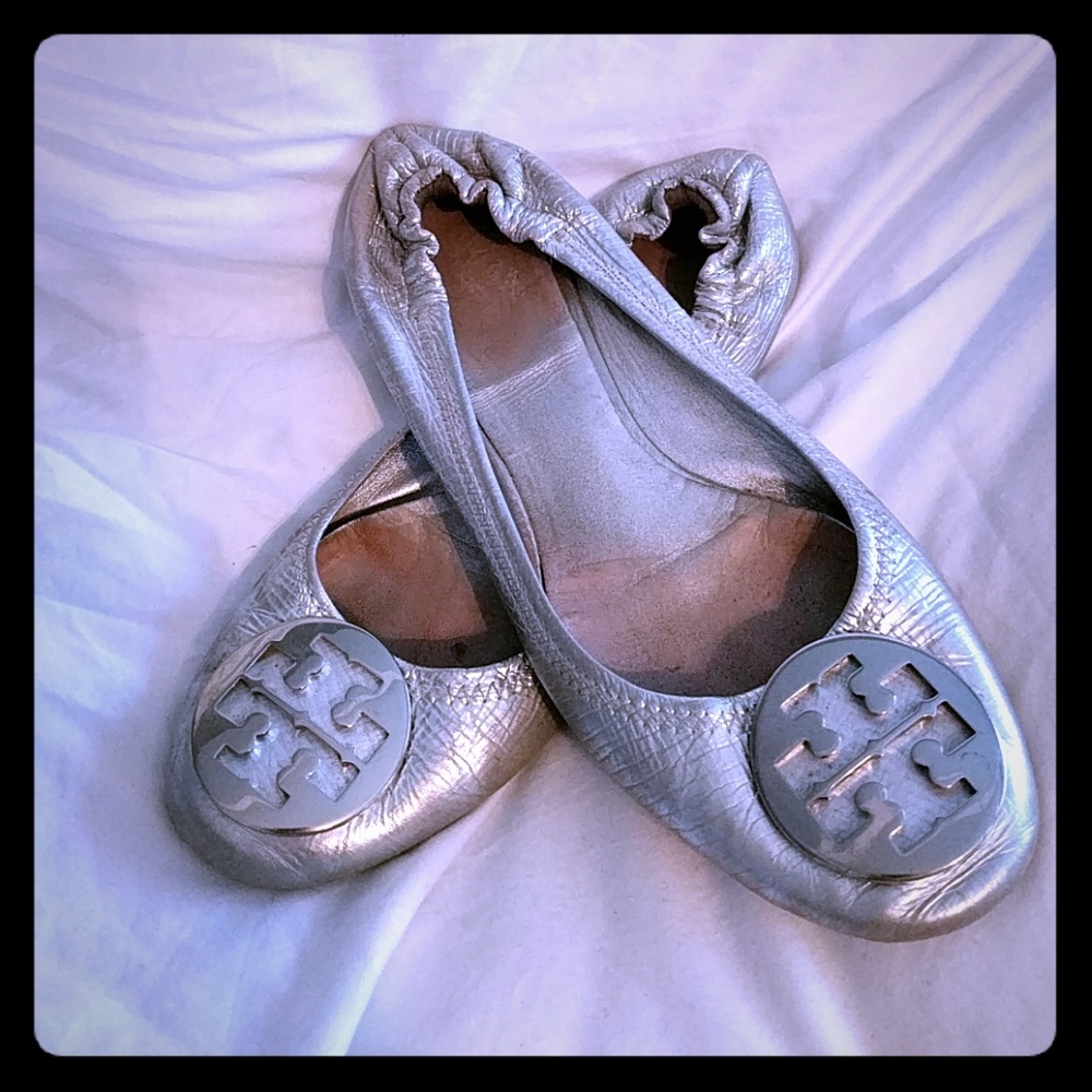 Well loved silver tory reva flats